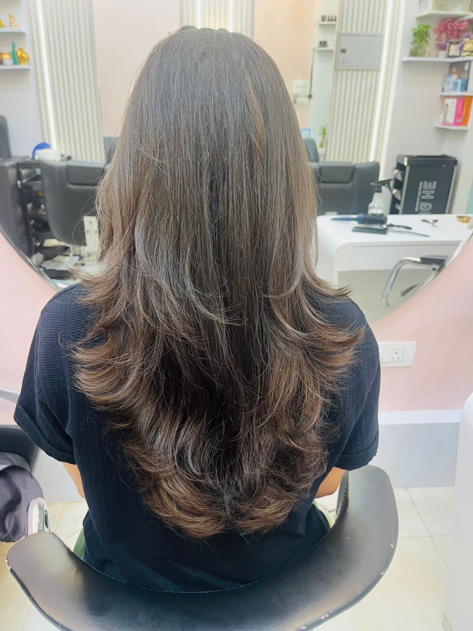 Layered haircut for women at Glorious Beauty Salon, Mira Road